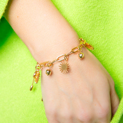 The gold Coco Bracelet with a drawstring chain fastening to adjust to desired length